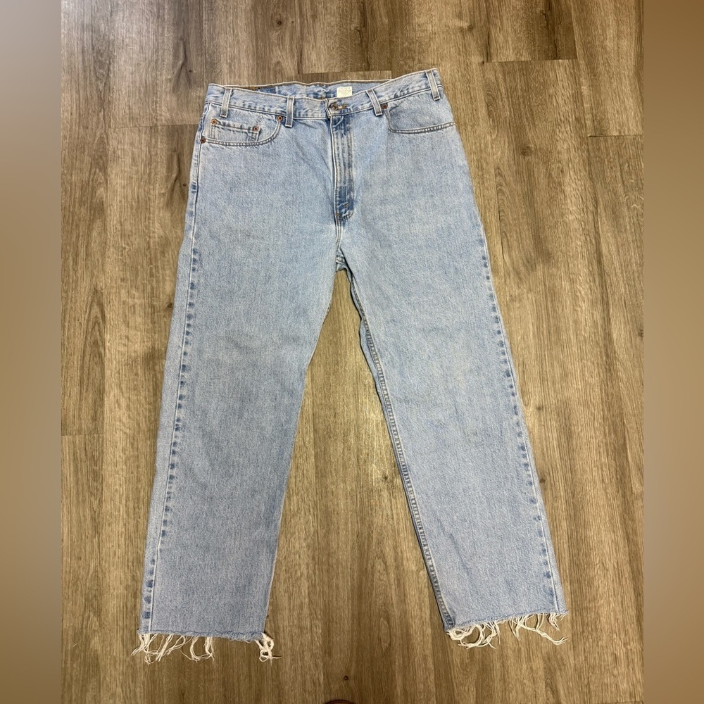 Vintage 90’s Levi 505 straight leg light wash denim with cut raw hem 38x30